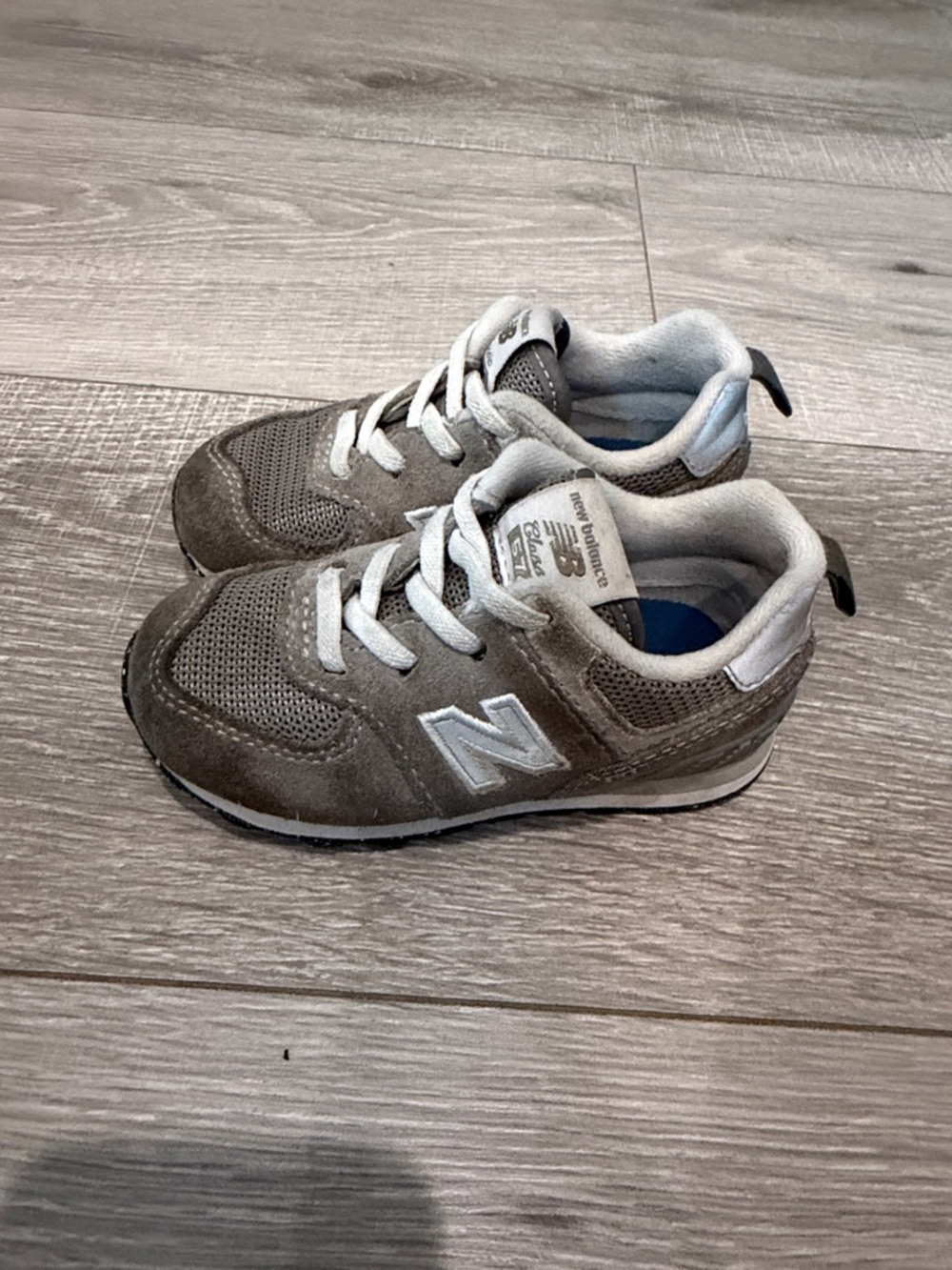 New Balance Kids Gray and White Sneakers